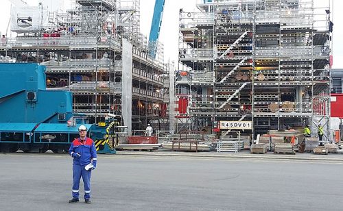 SEC Norge Foreman in front of Nyhamna modules at Stord yard.jpg